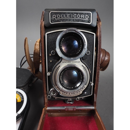 96 - A Rollicord twin lens reflex camera, in case, and a light meter