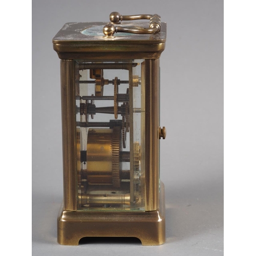 98 - A brass cased carriage clock with white enamel dial and Roman numerals, with key