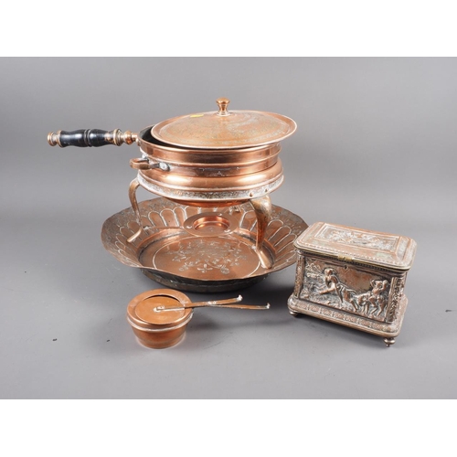 125 - A Persian copper chafing dish with burner and stand, an embossed copper charger and a 19th century c... 