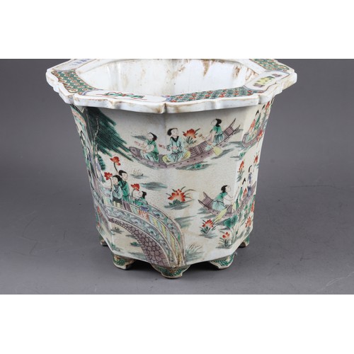 70 - A Chinese porcelain octagonal planter, decorated figures, 9