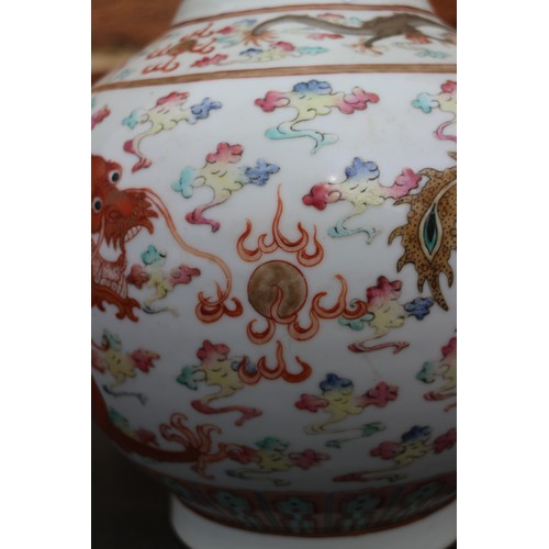 87 - A Chinese polychrome bulbous vase with Imperial five-toed dragon decoration and six-character mark, ... 