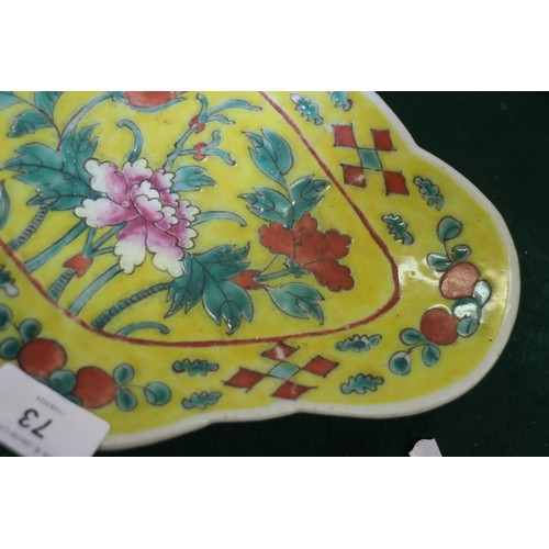 73 - A Chinese porcelain cloud shaped shallow dish, decorated insects, 9 1/2