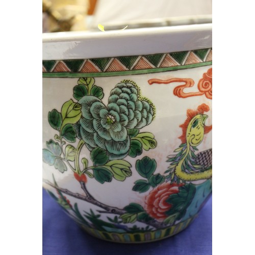 70 - A Chinese porcelain octagonal planter, decorated figures, 9