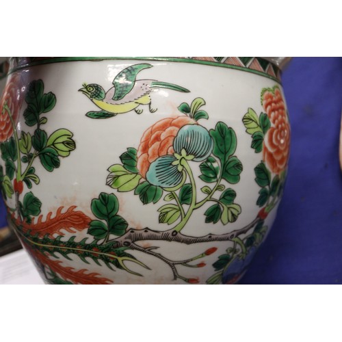 70 - A Chinese porcelain octagonal planter, decorated figures, 9