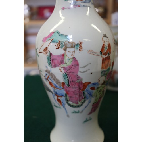 74 - A Chinese porcelain baluster vase, decorated four figures in a landscape, 9 1/2