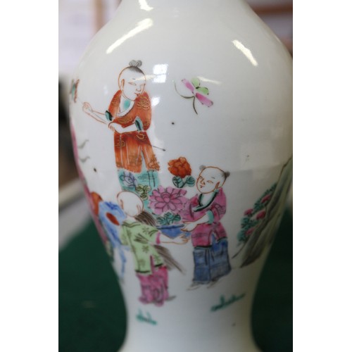 74 - A Chinese porcelain baluster vase, decorated four figures in a landscape, 9 1/2