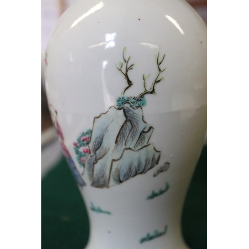 74 - A Chinese porcelain baluster vase, decorated four figures in a landscape, 9 1/2