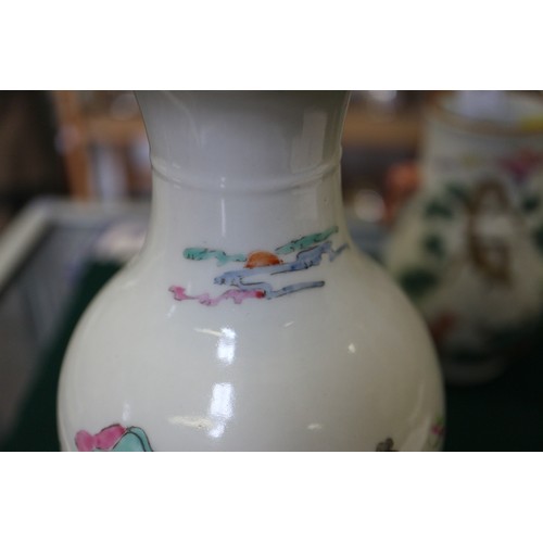 74 - A Chinese porcelain baluster vase, decorated four figures in a landscape, 9 1/2