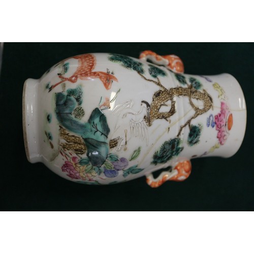 74 - A Chinese porcelain baluster vase, decorated four figures in a landscape, 9 1/2