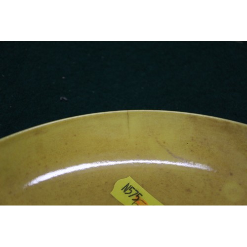 72 - A Chinese yellow glazed shallow dish with six-character mark to base, 7