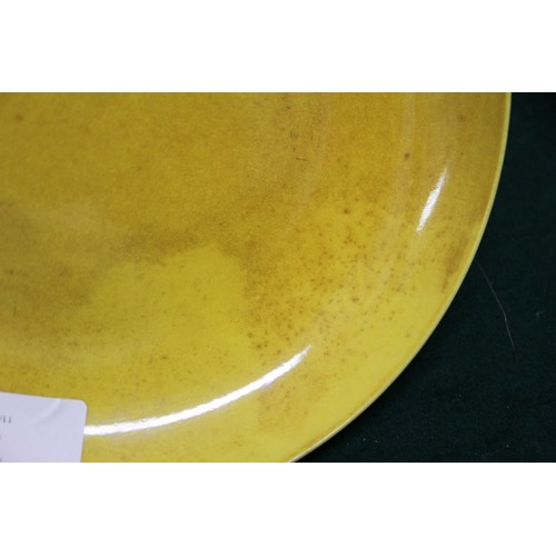 72 - A Chinese yellow glazed shallow dish with six-character mark to base, 7