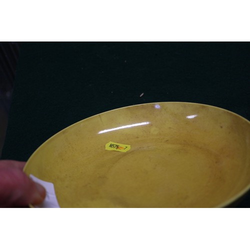 72 - A Chinese yellow glazed shallow dish with six-character mark to base, 7