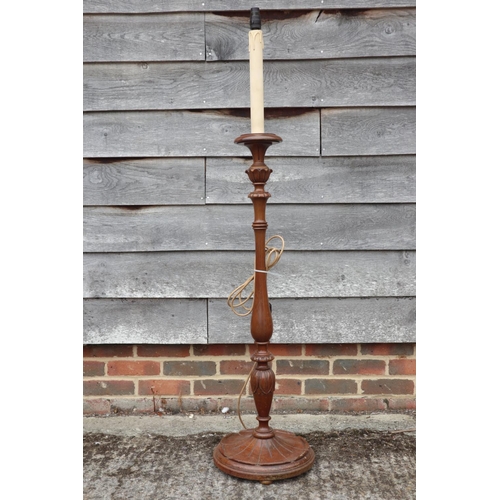 234 - A 1950s carved walnut standard lamp, on circular base, 54