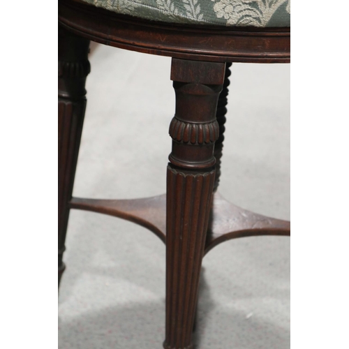 441 - A 19th century mahogany circular top adjustable seat piano stool, on reeded supports, 13