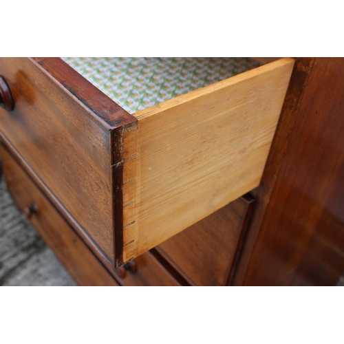 446 - An early 19th century mahogany campaign chest of four long graduated drawers with knob handles, on b... 