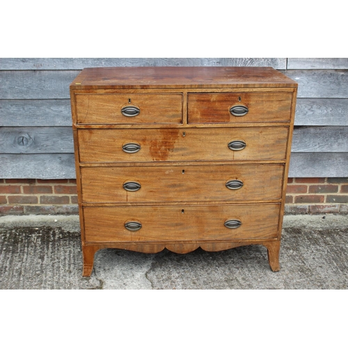 450 - A Georgian mahogany and ebony strung chest of two short and three long graduated drawers with emboss... 