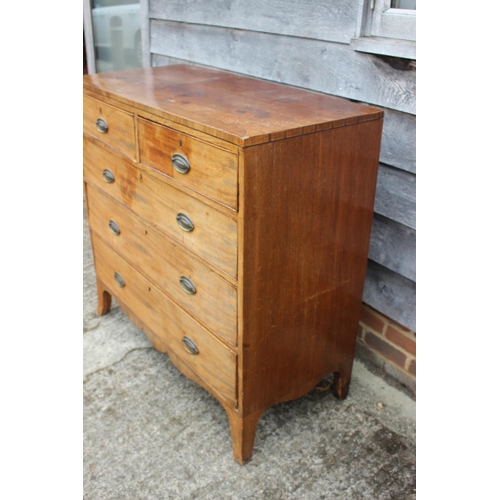 450 - A Georgian mahogany and ebony strung chest of two short and three long graduated drawers with emboss... 