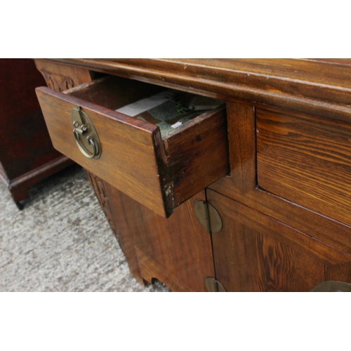 452 - An antique Chinese elm altar chest, fitted three drawers over cupboards enclosed four doors, 82