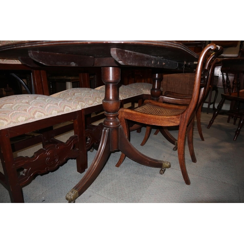 518 - A mahogany twin pedestal ‘D’ end dining table, on turned column and quadruple splay supports, 19