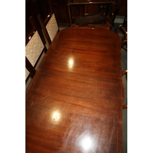 518 - A mahogany twin pedestal ‘D’ end dining table, on turned column and quadruple splay supports, 19