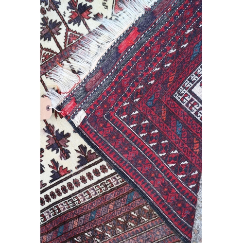 583 - A Bokhara tribal prayer rug with tree design on a white ground and multi-borders in traditional shad... 