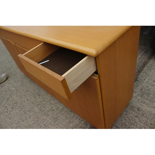 485 - A Skovby light oak side board, fitted three drawers over three cupboards, 66