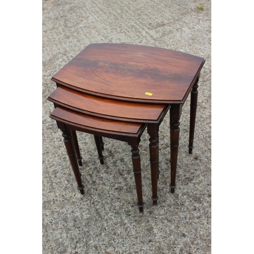 511 - An early 20th century carved walnut circular top two-tier occasional table, on panel supports, 18 1/... 