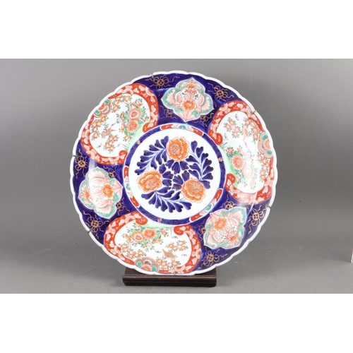 115 - A Japanese Imari charger with floral centre, seal marks, 18