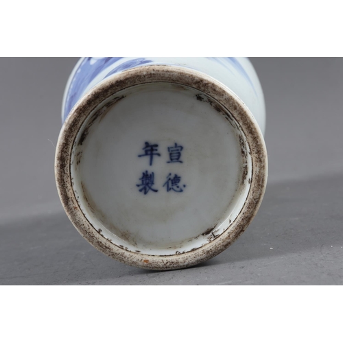 119 - A pair of Chinese blue and white gu vases with floral decoration and double ring marks to base, 10