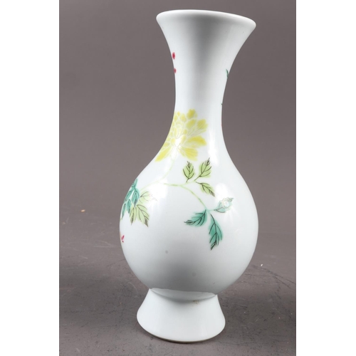 124 - A Chinese famille verte baluster vase with flower and leaf decoration, 7 3/4