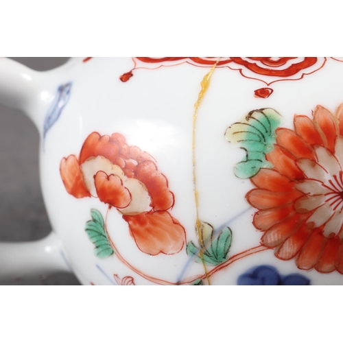 124 - A Chinese famille verte baluster vase with flower and leaf decoration, 7 3/4