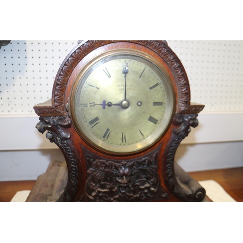 136 - A carved oak mantel clock with eight-day striking movement with gilt dial and Roman numerals, 17