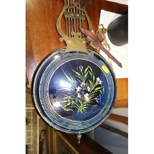 138 - A 19th century French comtoise wall clock with embossed brass case and enamelled dial, compensating ... 