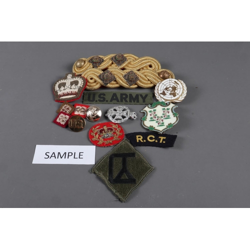 185 - A quantity of British and American military badges, cap badges and patches, various