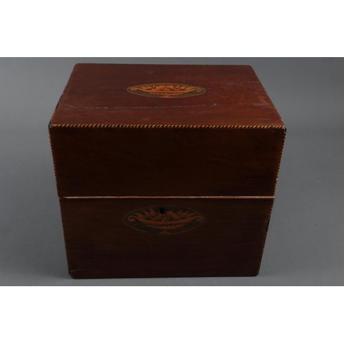 215 - A late Georgian mahogany and inlaid two-handle decanter box, containing six gilt decorated decanters... 