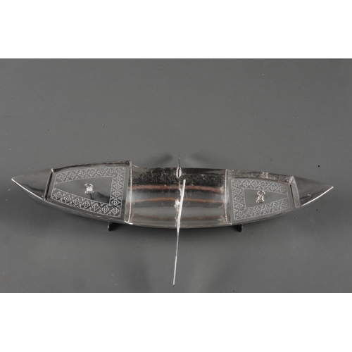 265 - An Arabian? white metal model of a rowing boat with engraved decoration, 9 1/2