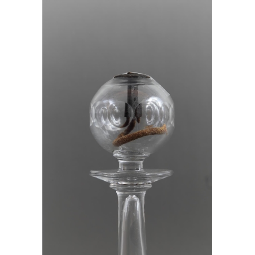 37 - A lacemaker's late 18th century blown glass lamp, on circular foot with cut reservoir, 10 3/4