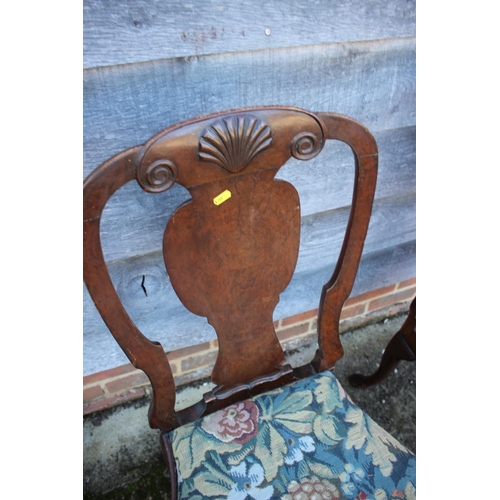 389 - A pair of Queen Anne style walnut splat back standard dining chairs with foliate embroidered drop in... 