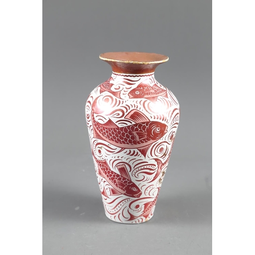 4 - A William de Morgan ruby lustre vase with fish design, 8 1/2