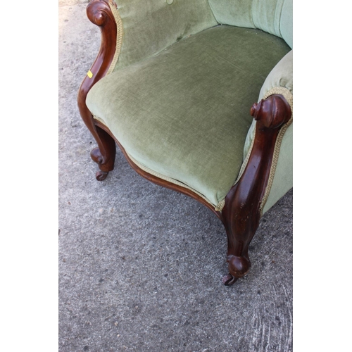 407 - A late Victorian mahogany showframe armchair, button upholstered in a sage green velour, on cabriole... 