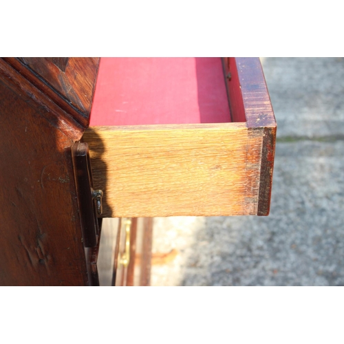 420 - An 18th century mahogany and banded fall front bureau, the fitted interior with drawers, pigeon hole... 