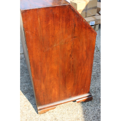 420 - An 18th century mahogany and banded fall front bureau, the fitted interior with drawers, pigeon hole... 