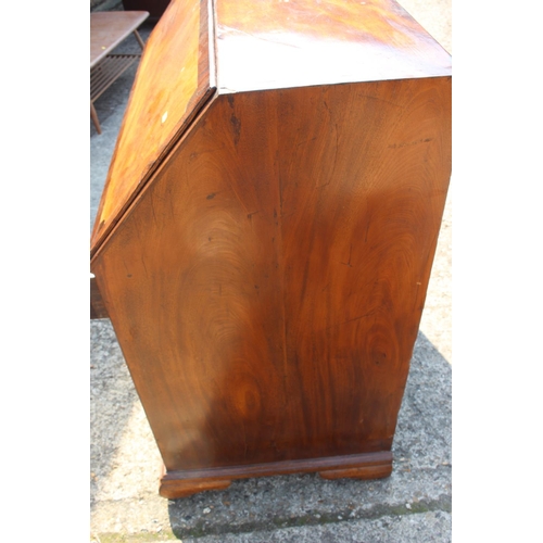 420 - An 18th century mahogany and banded fall front bureau, the fitted interior with drawers, pigeon hole... 