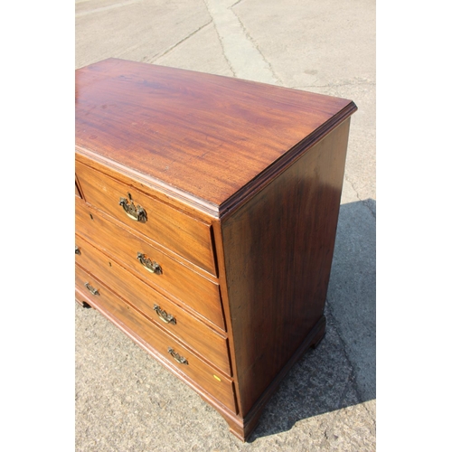 421 - A George III mahogany chest of two short and three long graduated drawers with later brass handles, ... 