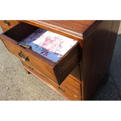 421 - A George III mahogany chest of two short and three long graduated drawers with later brass handles, ... 