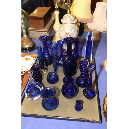 48 - Seventeen blue glass vases, various