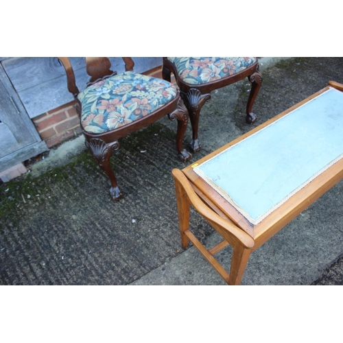 486 - A walnut duet stool, upholstered in blue fabric, on square tapered stretchered supports