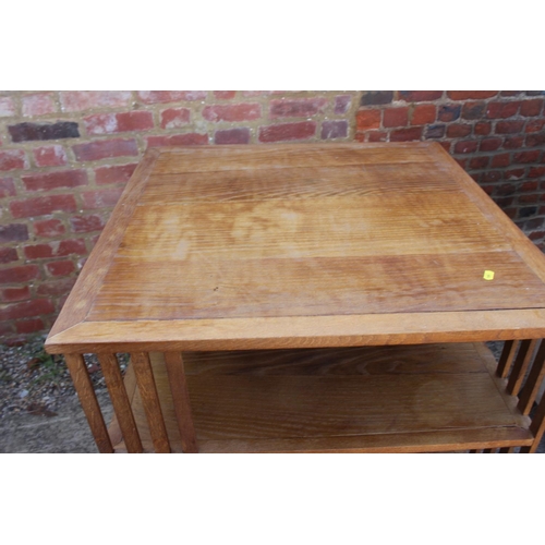 491 - A 1930s oak three-tier revolving bookcase, 28