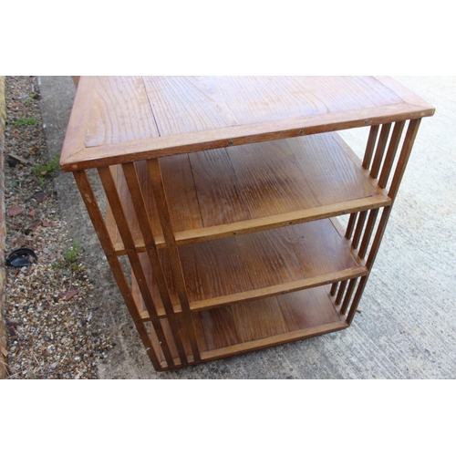 491 - A 1930s oak three-tier revolving bookcase, 28