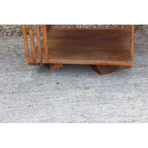 491 - A 1930s oak three-tier revolving bookcase, 28